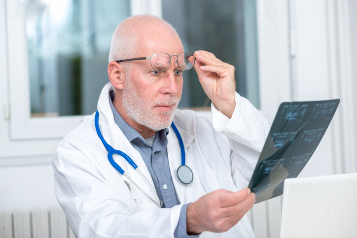 Doctor looking shocked while reviewing test results